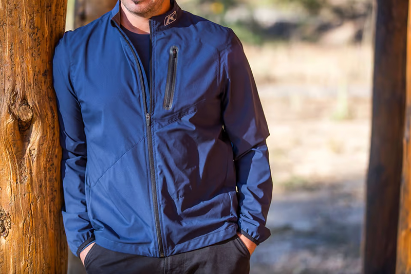 Guy wearing blue Klim Zephyr Wind Shirt